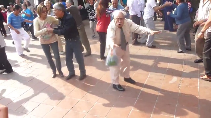 old man dancing with canes